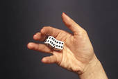 Dice in palm, close up