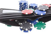 multicolor poker chips in black leather wallet